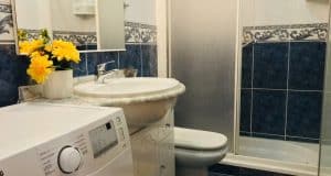 appartamento in vendita al piano terra fronte piscina nel complesso surycan zona sonnenland in gran canaria composto da una camera da letto un bagno cucina e salone più patio esterno.