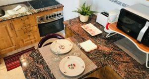 appartamento in vendita al piano terra fronte piscina nel complesso surycan zona sonnenland in gran canaria composto da una camera da letto un bagno cucina e salone più patio esterno.